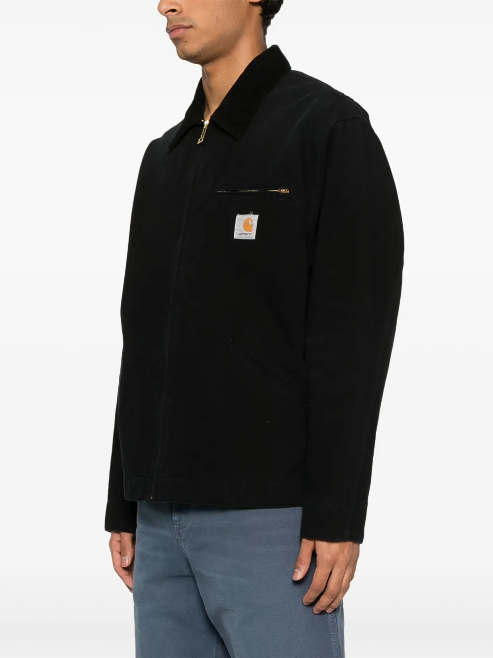 Black jacket worn by a person, showing the jacket's fit