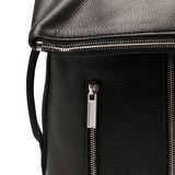 Close up of black bags, showing texture of the calf leather and cotton fabric