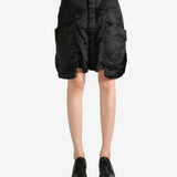 Black shorts worn by a person, showing the shorts's fit