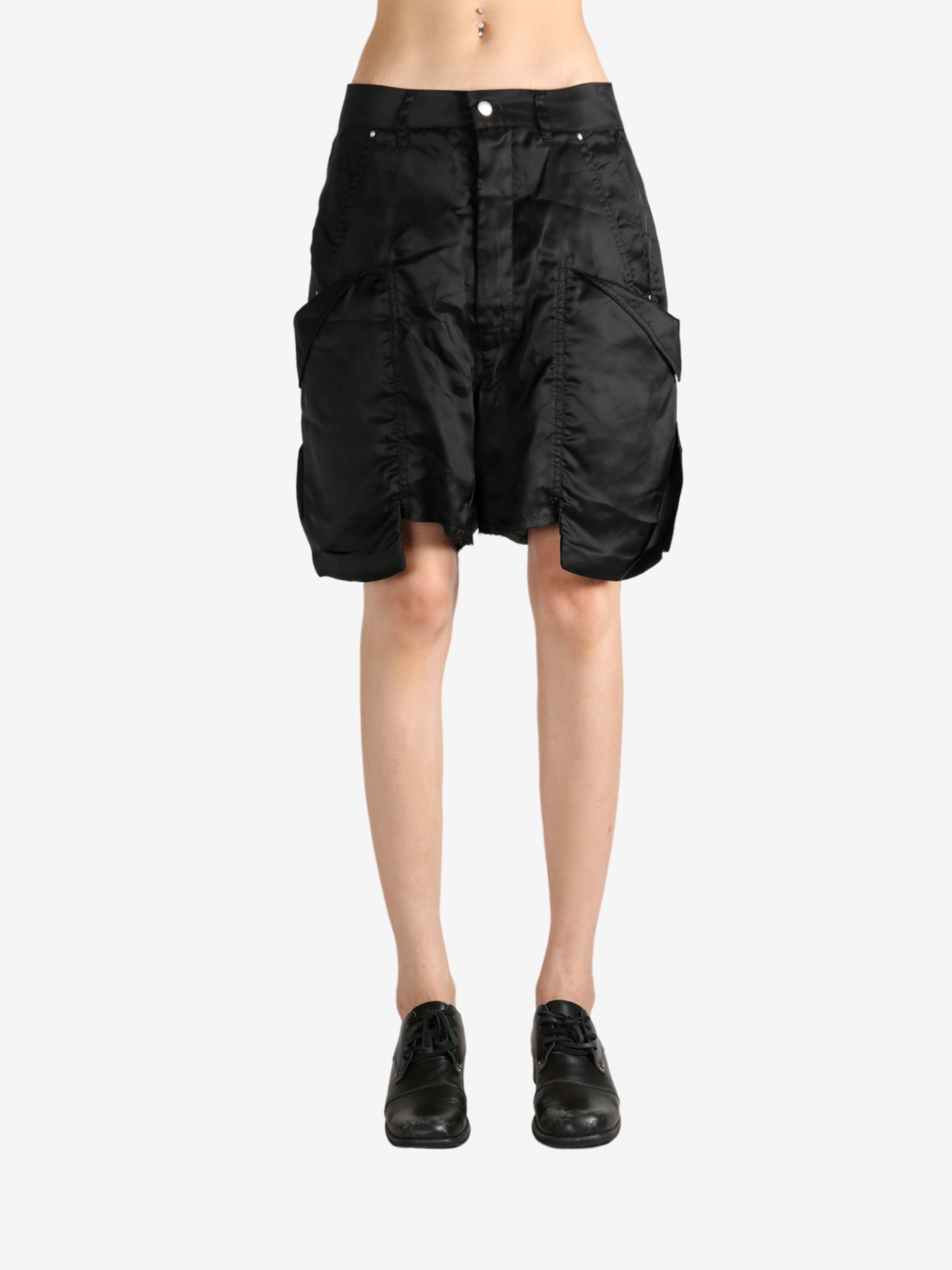 Black shorts worn by a person, showing the shorts's fit