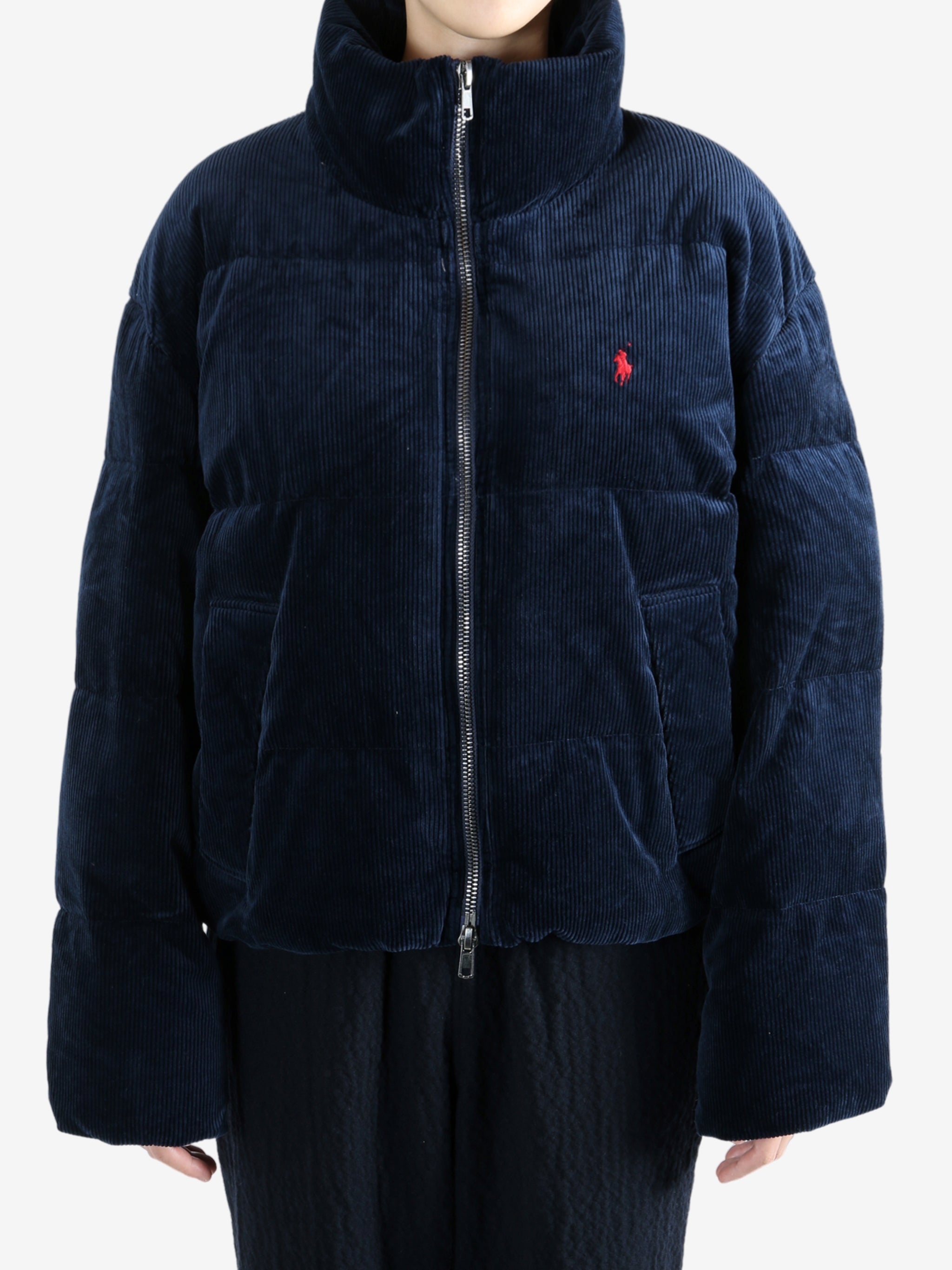 Navy coats worn by a person, showing the coats fit