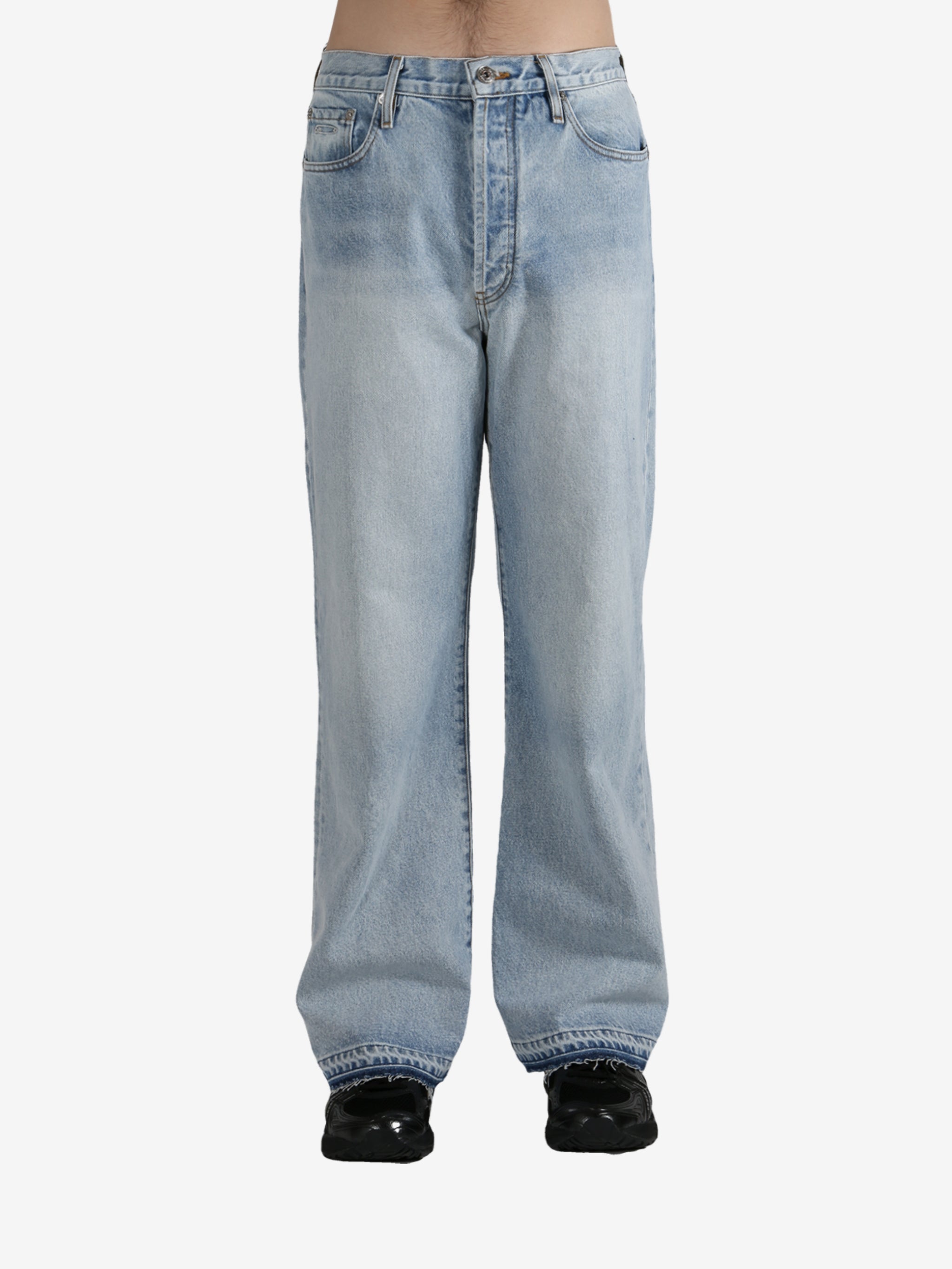 Blue jeans worn by a person, showing the jeans's fit