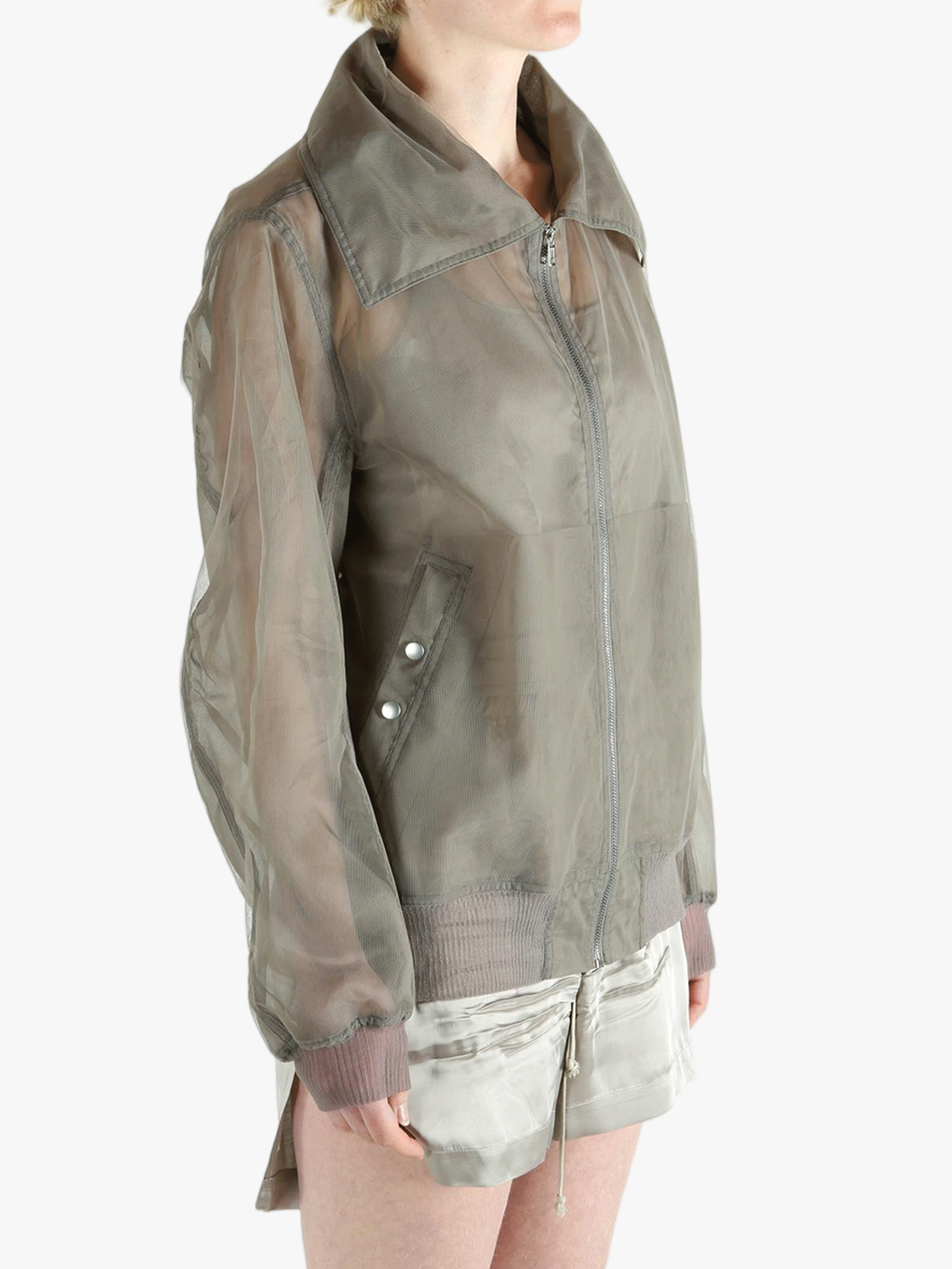 Grey jacket worn by a person, showing the jacket's fit