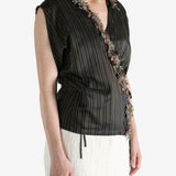 Brown top worn by a person, showing the top fit