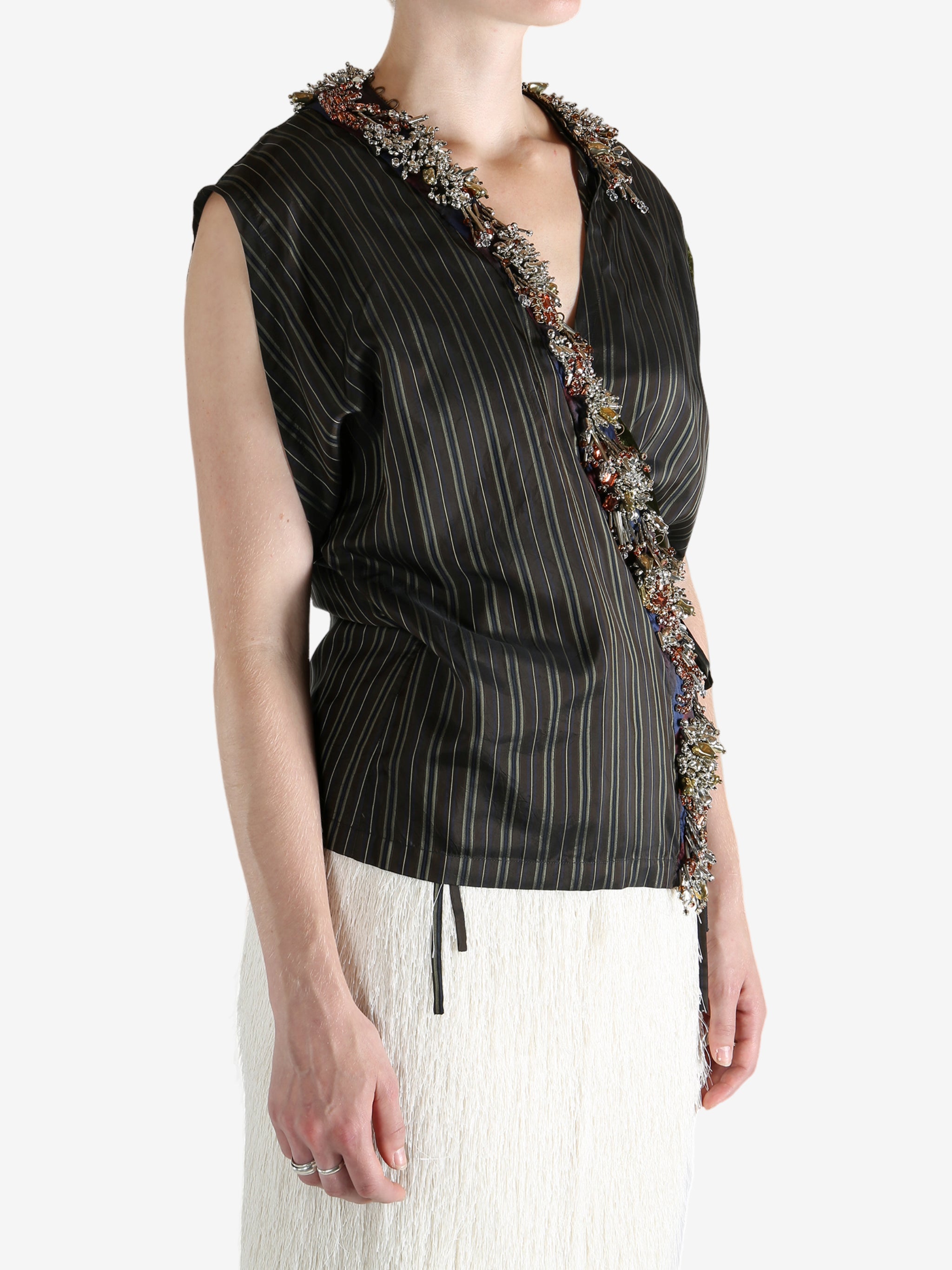 Brown top worn by a person, showing the top fit