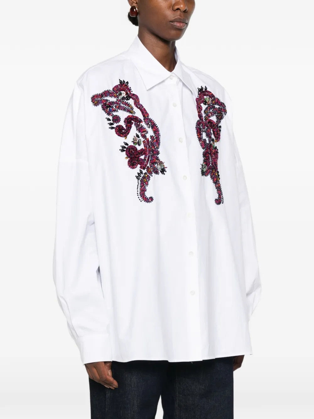 White shirt worn by a person, showing the shirt fit