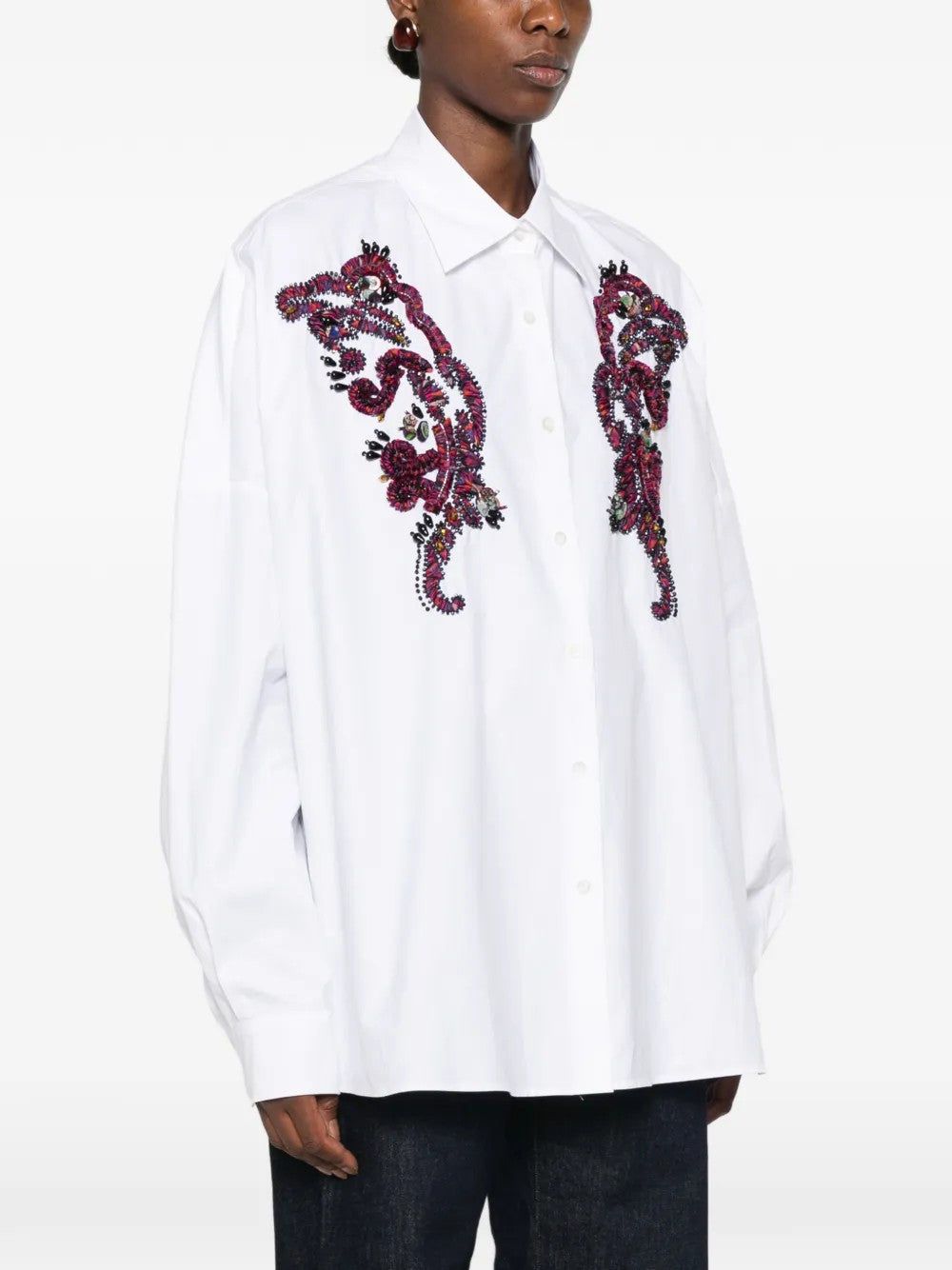 White shirt worn by a person, showing the shirt fit
