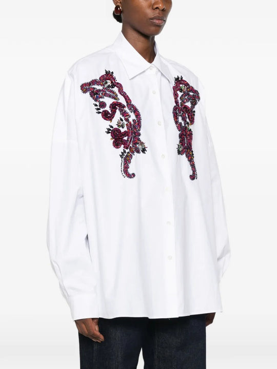 White shirt worn by a person, showing the shirt fit