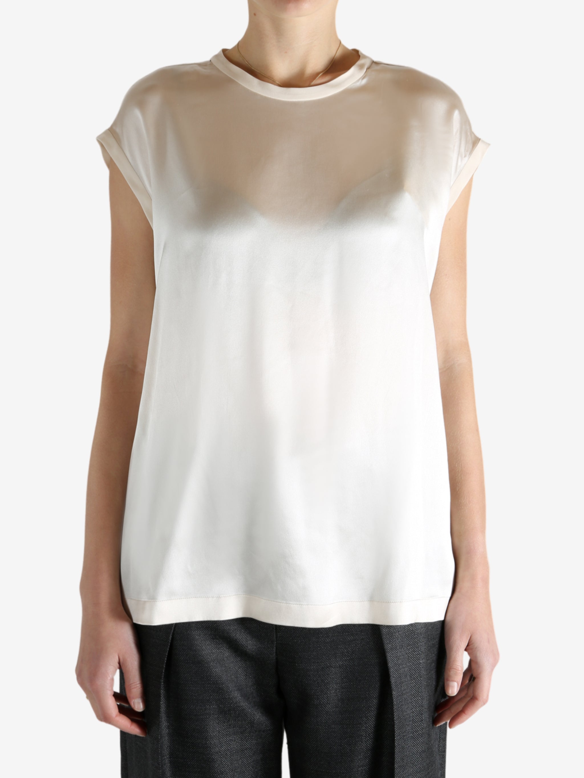 Grey t-shirts worn by a person, showing the t-shirts fit