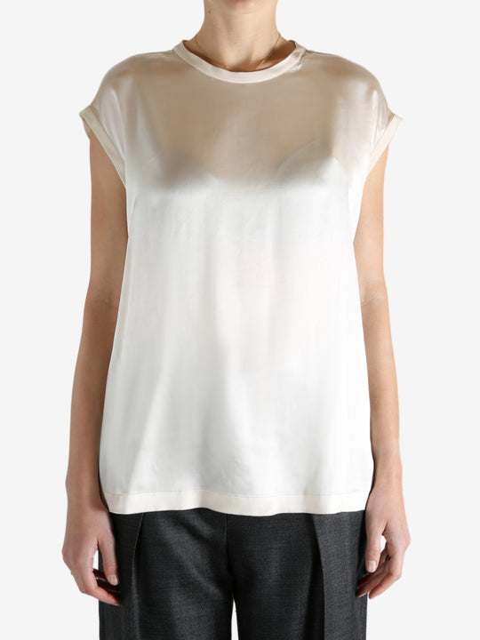 Grey t-shirts worn by a person, showing the t-shirts fit