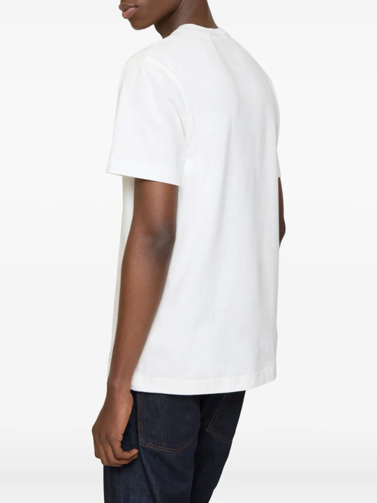 White t-shirts worn by a person, showing the t-shirts fit