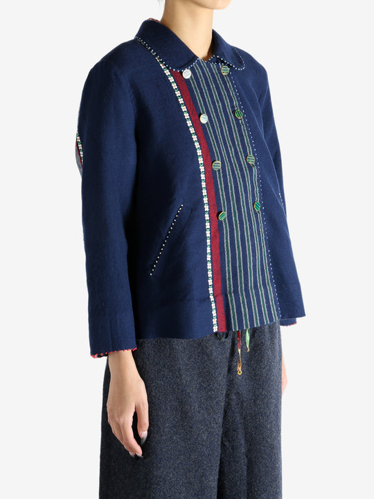 Navy jacket worn by a person, showing the jacket fit