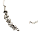 Close up of grey bracelet, showing texture of the silver fabric