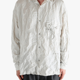 White shirts worn by a person, showing the shirts fit