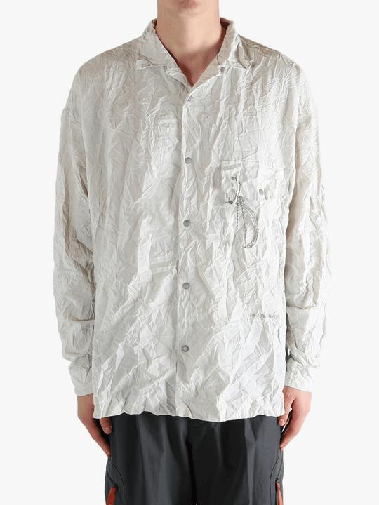 White shirts worn by a person, showing the shirts fit