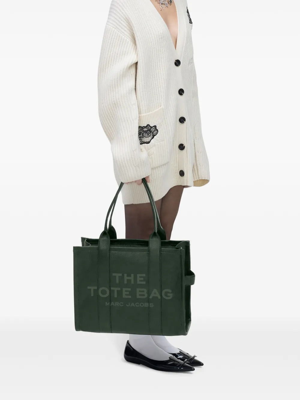 Green bag worn by a person, showing the bag's fit