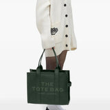 Green bag worn by a person, showing the bag's fit