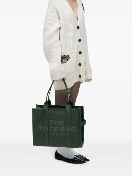 Green bag worn by a person, showing the bag's fit