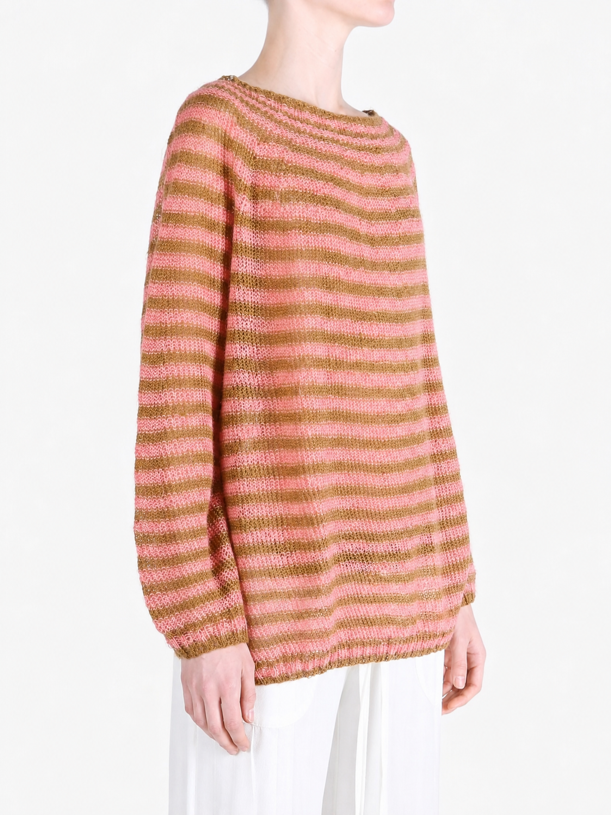Pink knitwear worn by a person, showing the knitwear fit