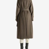 Brown coat worn by a person, showing the coat fit