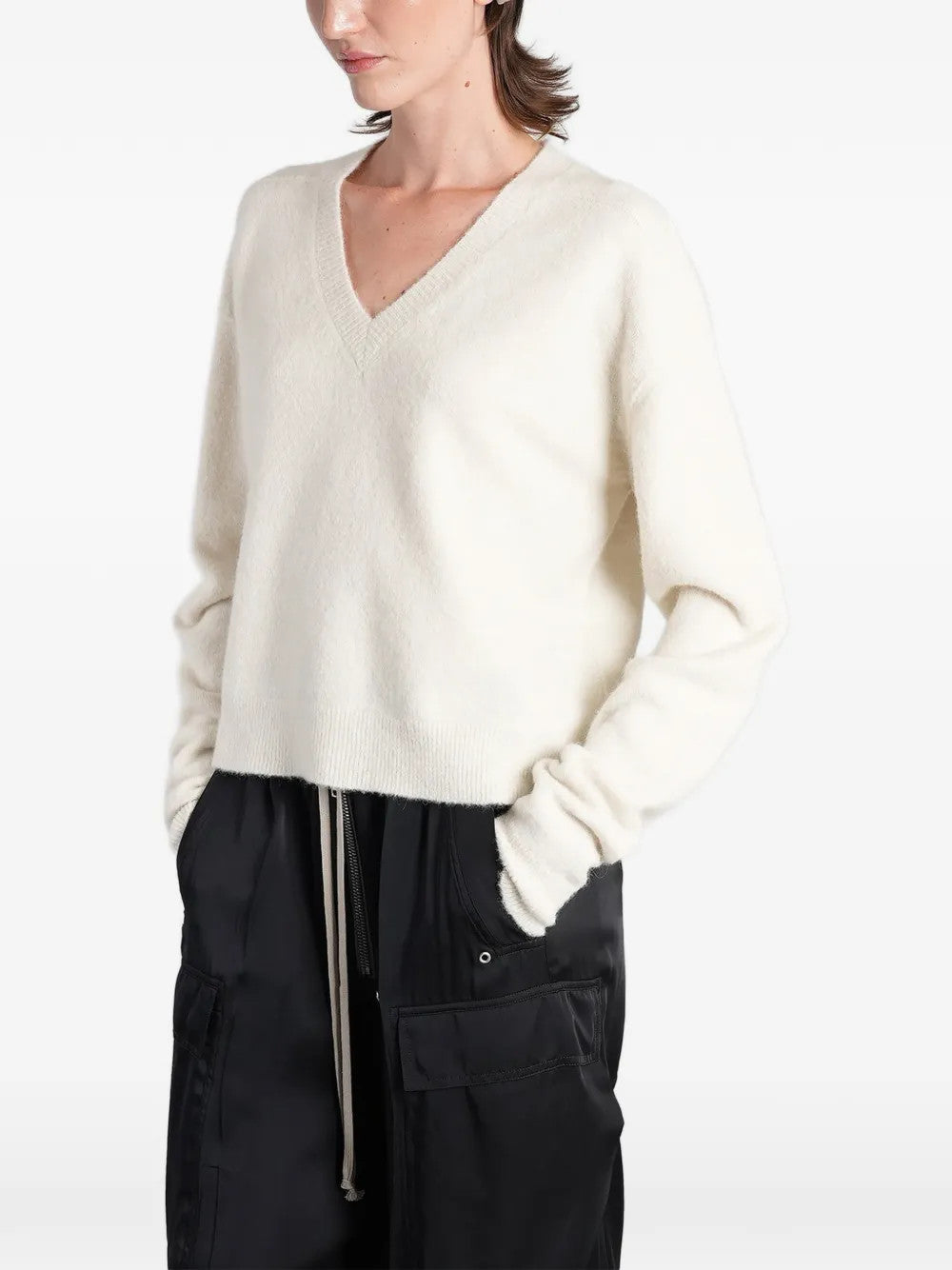 White top worn by a person, showing the top fit