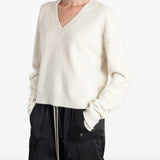 White top worn by a person, showing the top fit