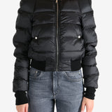 Black jacket worn by a person, showing the jacket fit