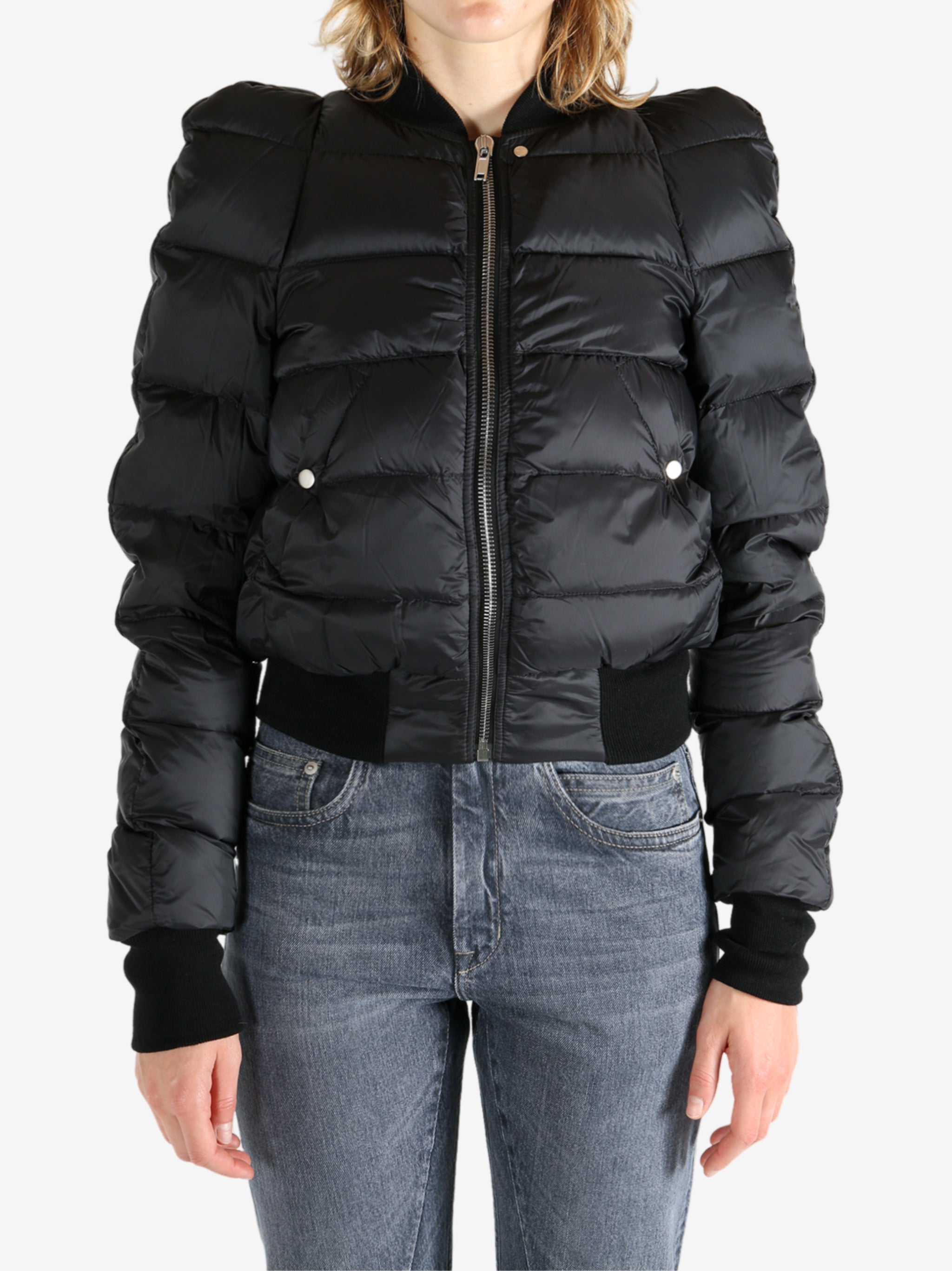 Black jacket worn by a person, showing the jacket fit