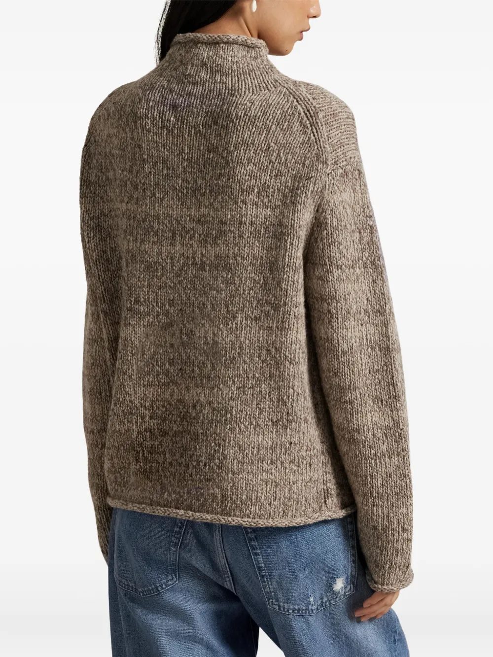 Tan sweater worn by a person, showing the sweater's fit