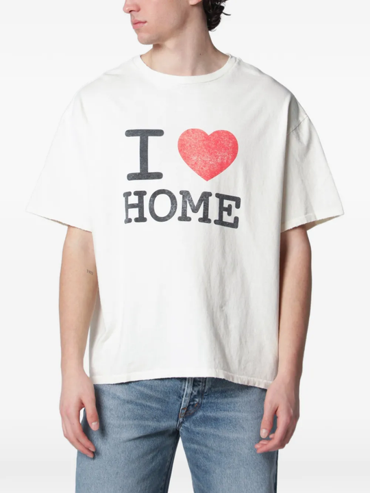 White t-shirt worn by a person, showing the t-shirt fit