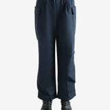 Navy pants worn by a person, showing the pants' fit