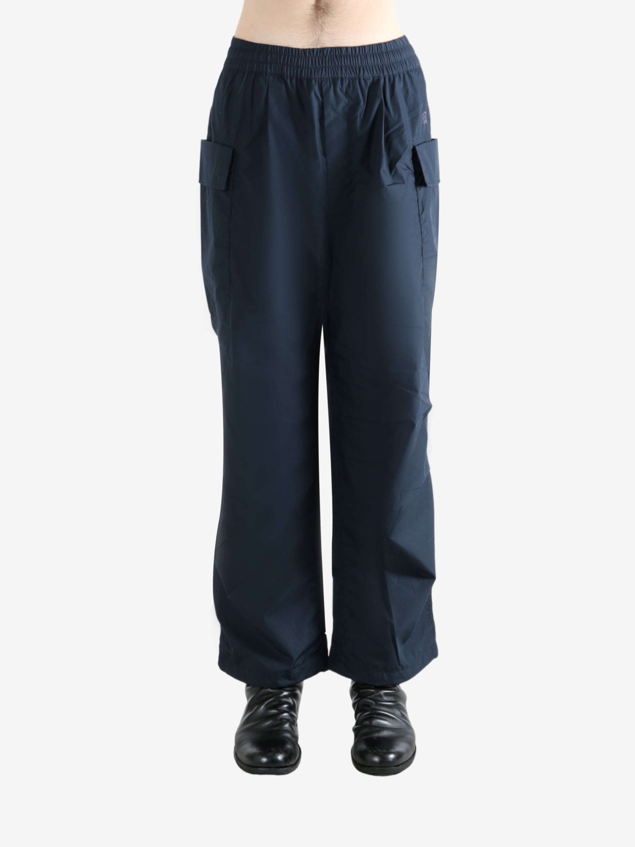 Navy pants worn by a person, showing the pants' fit