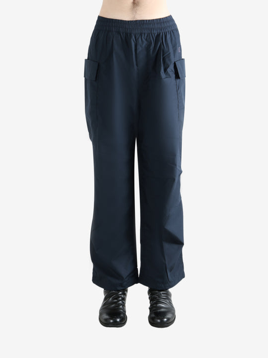 Navy pants worn by a person, showing the pants' fit