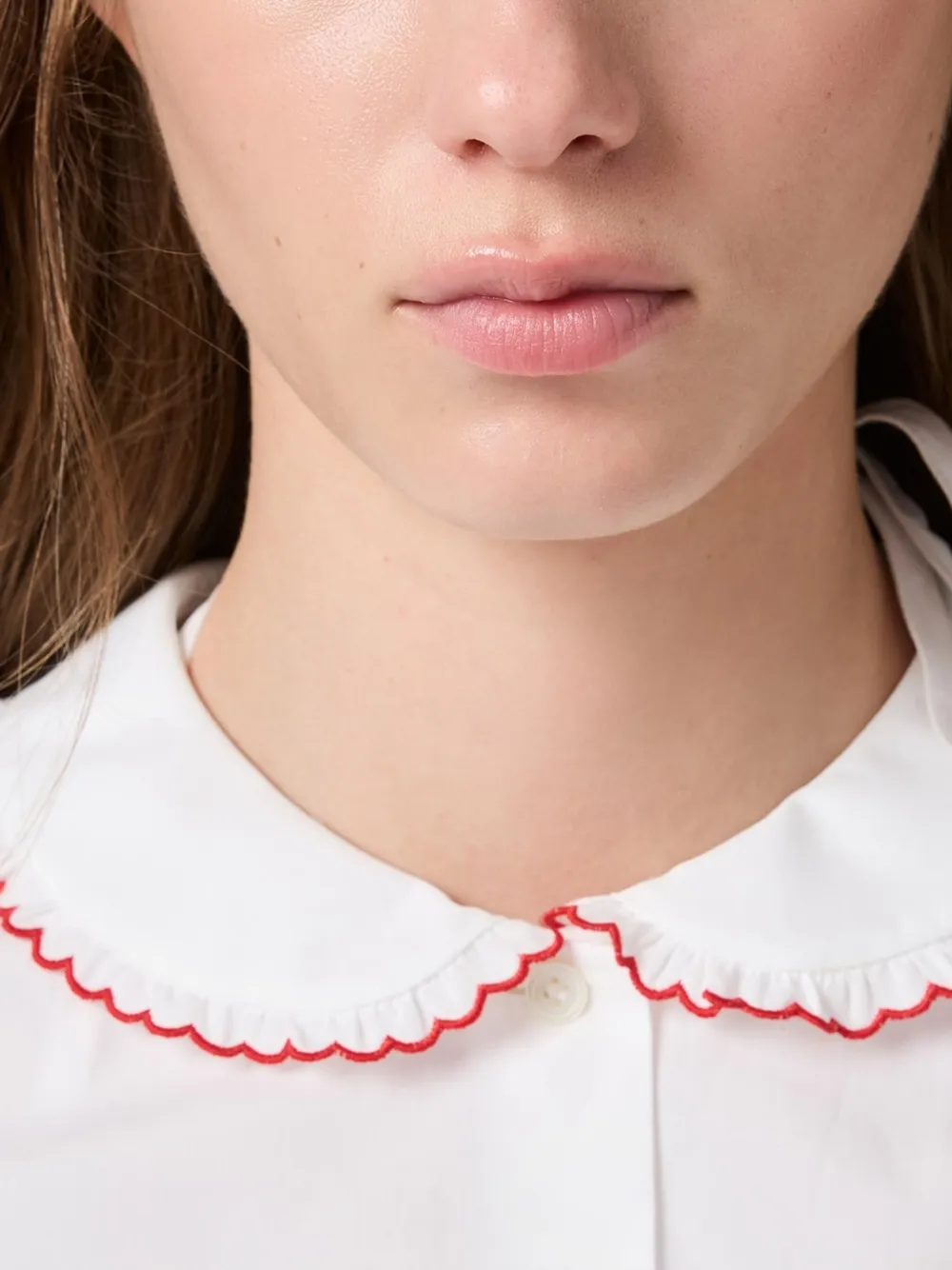 White shirt worn by a person, showing the shirt fit