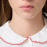 White shirt worn by a person, showing the shirt fit