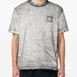 Black t-shirt worn by a person, showing the black t-shirt's fit