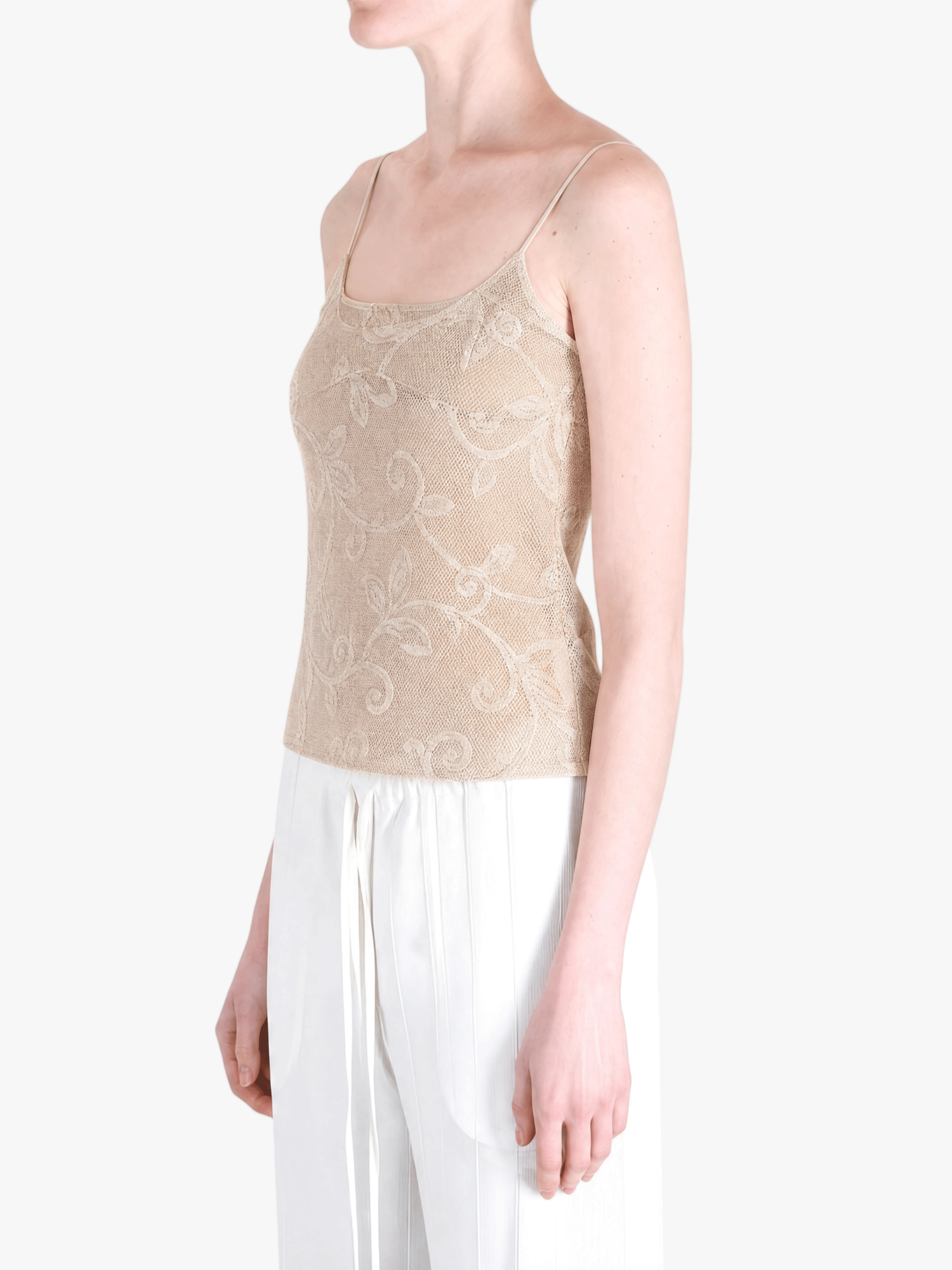Tan top worn by a person, showing the top fit