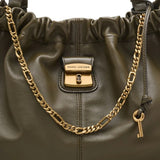 Close up of the green bag, showing texture of the leather fabric