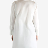 White shirts worn by a person, showing the shirts fit