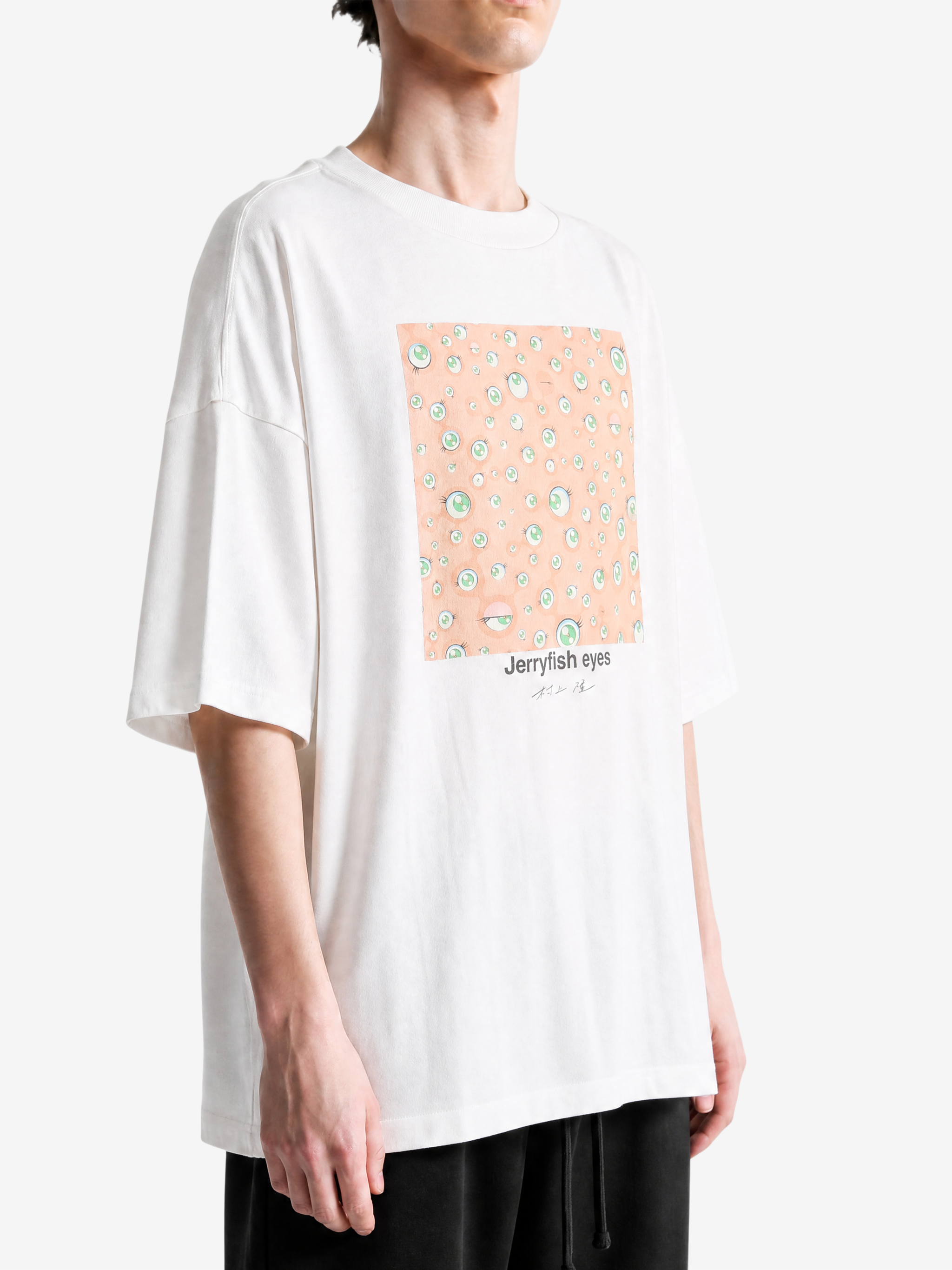 White t-shirt worn by a person, showing the t-shirt fit