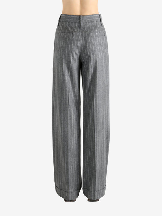 Grey pants worn by a person, showing the pant's fit