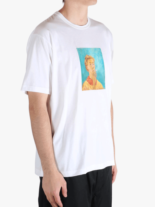 White t-shirt worn by a person, showing the t-shirt's fit