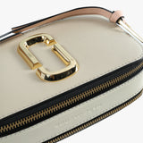 Close up of the tan bag, showing texture of the leather fabric