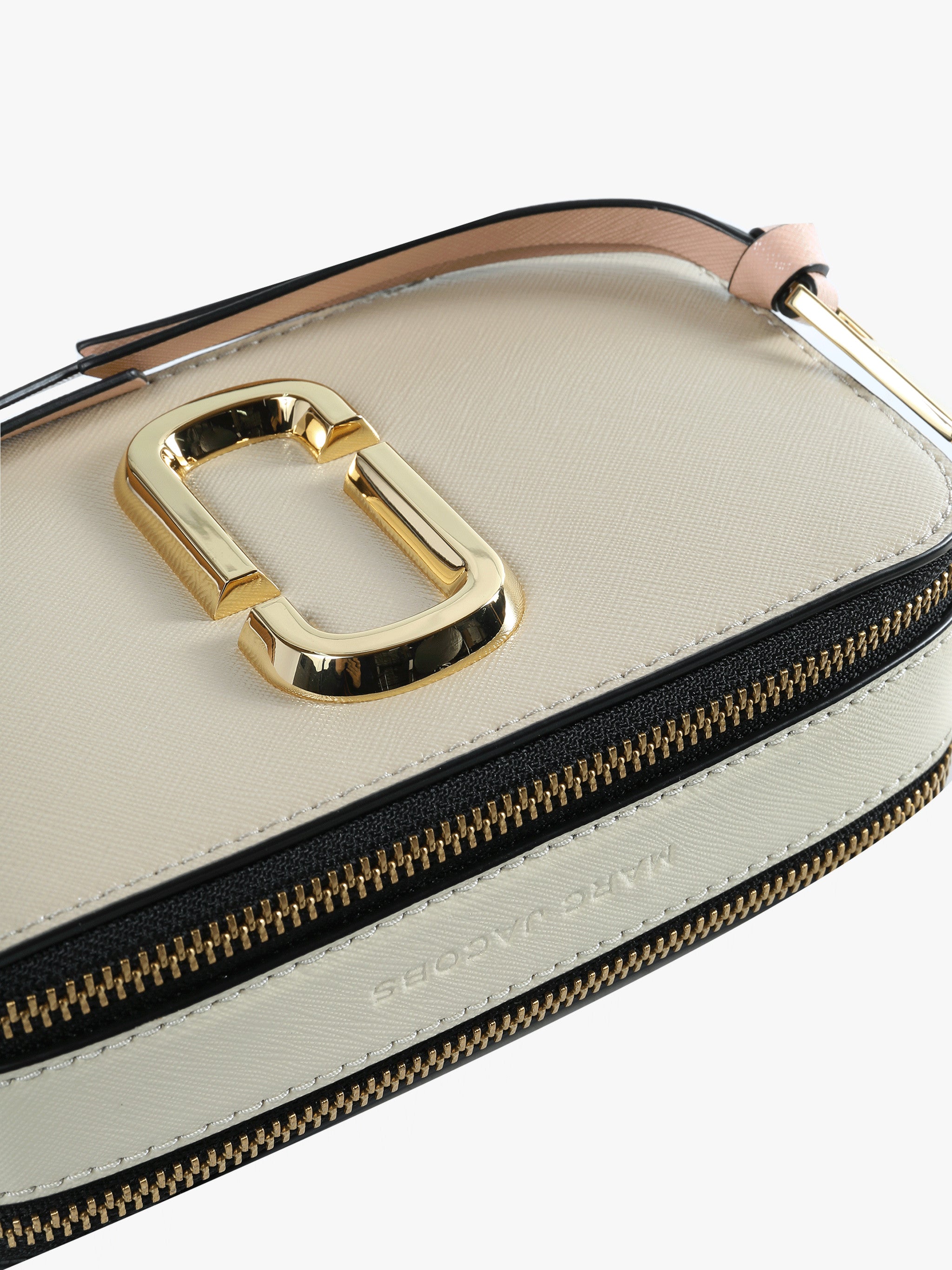 Close up of the tan bag, showing texture of the leather fabric