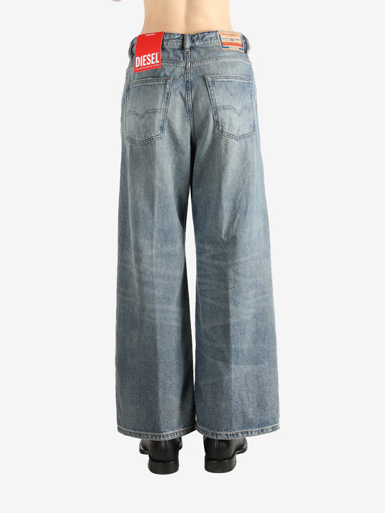 Blue jeans worn by a person, showing the jeans fit