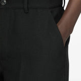 Black shorts worn by a person, showing the shorts fit
