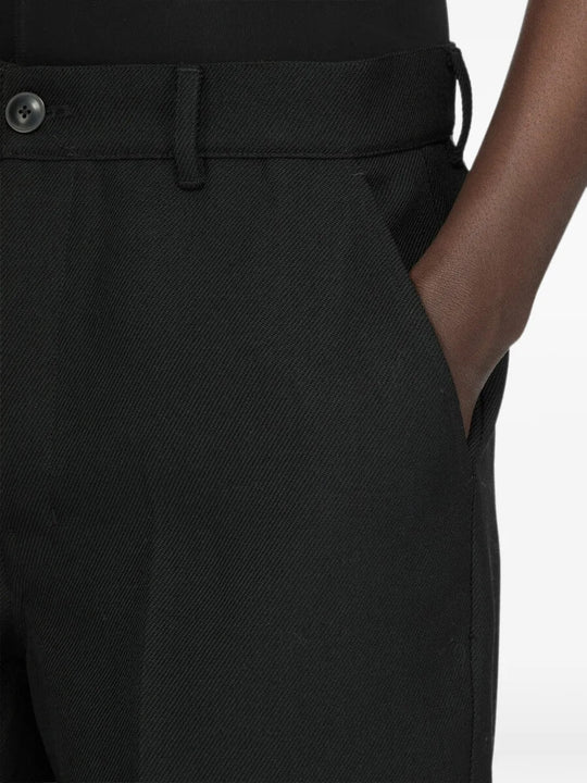Black shorts worn by a person, showing the shorts fit