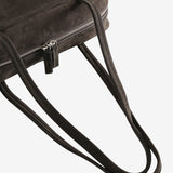 Close up of the brown bag, showing texture of the leather fabric