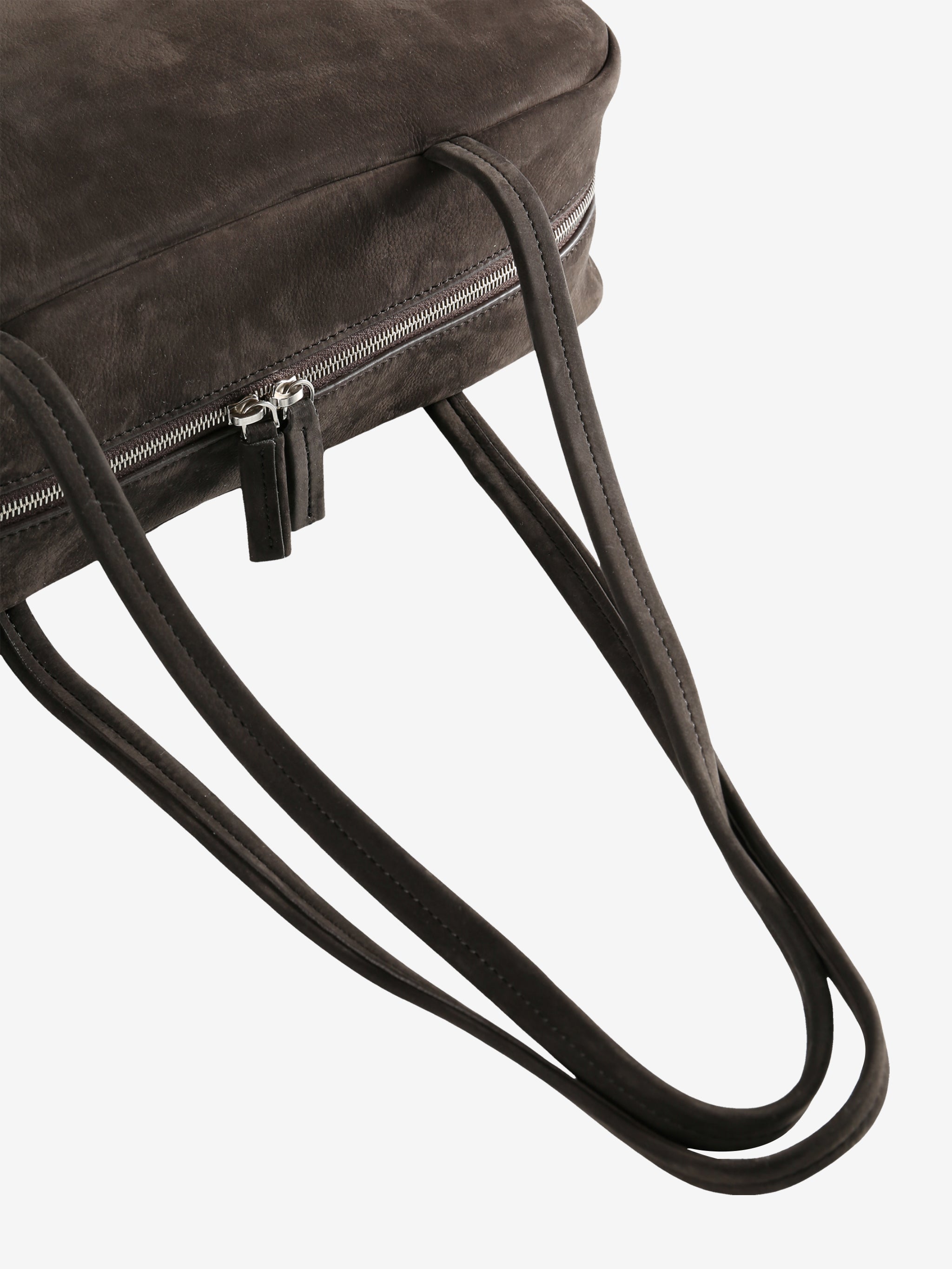 Close up of the brown bag, showing texture of the leather fabric