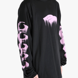 Black shirt worn by a person, showing the shirt's fit
